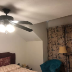 Bedroom photo with fan light on